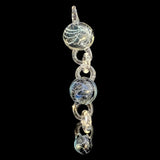 Wil Glass and Mina Glass particle collider pendant, three attachments linked on a clear glass chain, full length