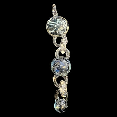 Wil Glass and Mina Glass particle collider pendant, three attachments linked on a clear glass chain, full length