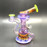 Andy G glass recycler in purple with UV reversal line work, a clear marble on the side and a wig-wag band around the base