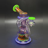 The same recycler under a UV light, the Ion color glowing green against a dark backdrop