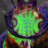 Close-up of the line work marble under a UV light, the Ion glowing green