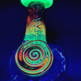 The mouthpiece and stem of the recycler under a UV light