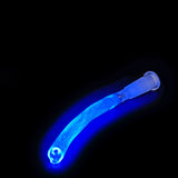 The removable two-hole UV diffuser lifted out of the tube, glowing under blacklight