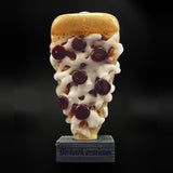 Biohazard Glass pizza Pivot top, a glass top for the Puffco Pivot shaped as a pizza slice with seven pepperoni, on its stand, front view