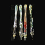 Close view of four Chris Barclay glass pens showing green and red inside-out frit and green and white inside-out line work