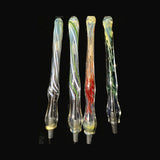 Close view of four Chris Barclay glass pens showing green and red inside-out frit and green and white inside-out line work