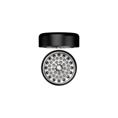 Flower Mill 2.5-inch stainless grinder with the lid lifted off, showing the perforated milling plate underneath.