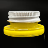 Empty 1 threaded glass jar in canary yellow with its white metal screw lid on, side view