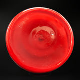Underside of the cherry red glass jar, marked on the base