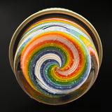 The glass jar from below, the line work and crushed opal meeting in a spiral on the underside