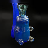 Close-up of the blue glass bear and the bowl on top of its head