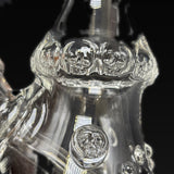 Close up of the skull stamps ringing the neck of the Hensley Glass mini tube