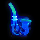 Hampton UV Sherlock under a blacklight, the body glowing blue and the bowl and stem green