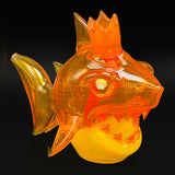 Niko Cray shark rig, a sculpted orange glass shark with a crown on its head, seen from the side