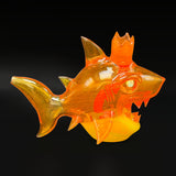 The shark rig from the side, tail to the left, on its yellow base