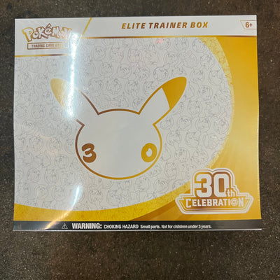 Pokémon TCG 30th Celebration Elite Trainer Box, front, factory sealed, on the High Tide shop floor in Santa Barbara
