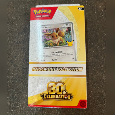 Pokémon TCG 30th Celebration Knock Out Collection with the Eevee promo, front, factory sealed, on the High Tide shop floor in Santa Barbara