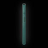 Puffco Hot Knife in Pine, deep green, cap on