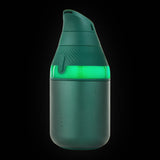 Puffco Proxy Core Kit in Pine, deep green, light ring lit, three-quarter view on a dark background