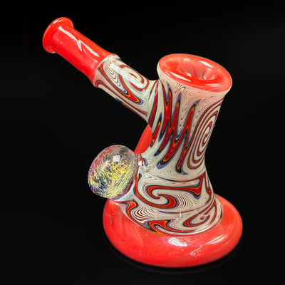 Sebastian snorkel bubbler by Seabass, three-quarter view, the dichro marble on the body and the flat mouthpiece angled up to the left