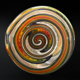 Close-up of a reverse ball, a spiral of red, orange, green and blue line work