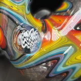 Close-up of the black and white wig wag millie marble at the bend of the stem