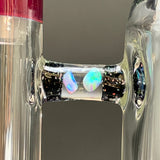 Close-up of the arm, crushed opal over black with two opals
