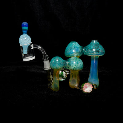 Christina Cody mushroom rig, teal speckled caps with a matching mushroom cap on the banger.