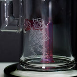 Close-up of the Pink Royal Jelly one, the second of the two in the shop, with the Sugar Magnolia mascot sandblasted into the glass