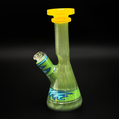 VP Glass mini tube in green glass with a yellow mouthpiece, six and a quarter inches tall, the 14 mm joint angled out to the left