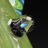 Close up of the opal marble set into the green glass, blue and green opal showing inside it