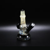 Wil Glass Particle Collider mini tube, silver stringers through a black jack fade, side view showing the 14mm joint