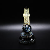 Particle collider attachment on the back of the mini tube, a domed cabochon of blue and silver stringers