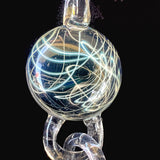 Close-up of the largest particle collider attachment on the pendant, with the bail above it