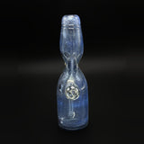 The Dabune bottle straight on, with the marble sitting inside the body