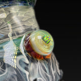 Close-up of the opal marble on the chamber, cream and amber with a green flash