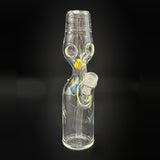 The clear Dabune bottle at an angle, the 14 mm joint at the right