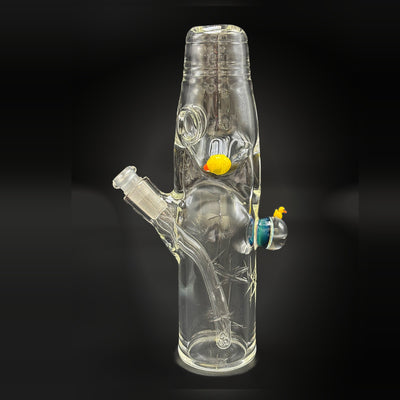 Wil Glass x Mina Glass Dabune bottle, straight on, with the glass duck and the duck marble on the body