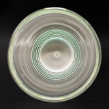 Looking down into the Wil Glass double layer cup, the green rings of the base through the clear glass