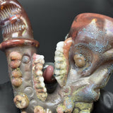 Close-up of the sculpted teeth and pink tongue on the underside of the Sherlock