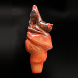 Side view of the sculpted glass dry pipe, the opening at the side of the head