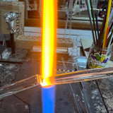 A glass tube heating to orange in the torch flame at the High Tide Santa Barbara studio, where the Intro to sculpting class is taught